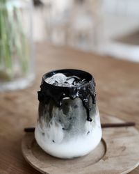 Close-up of drink in glass jar on table