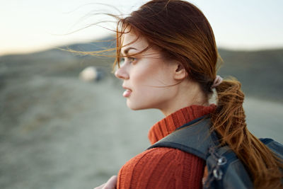 Portrait of young woman looking at camera