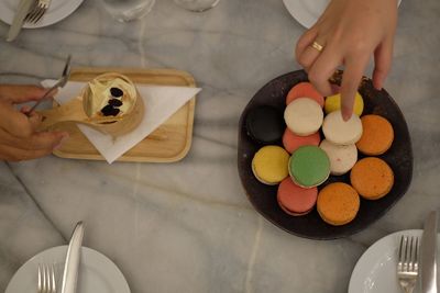 High angle view of person preparing food on table