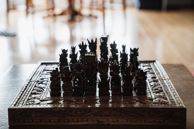 Close-up of chess pieces on table