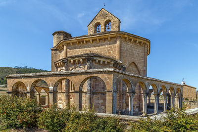 Low angle view of historical building against blue sky