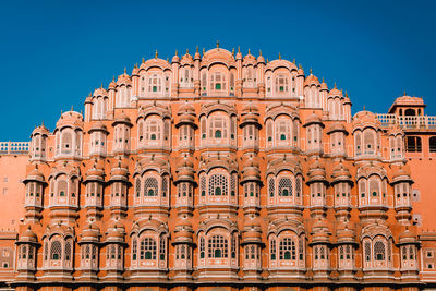 Low angle view of building against clear blue sky