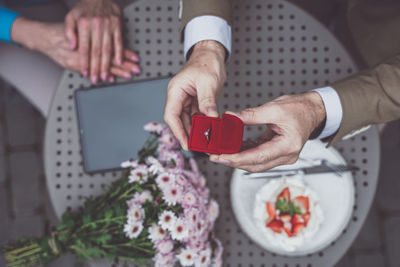 Midsection of woman using mobile phone