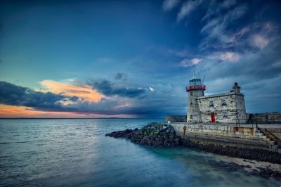 Scenic view of sea against cloudy sky