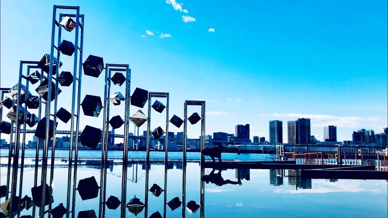 REFLECTION OF BUILDINGS IN SWIMMING POOL