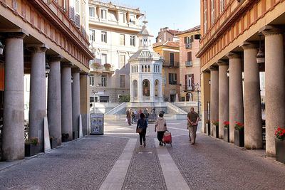 People walking on road in city