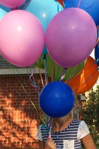 Multi colored balloons on white background