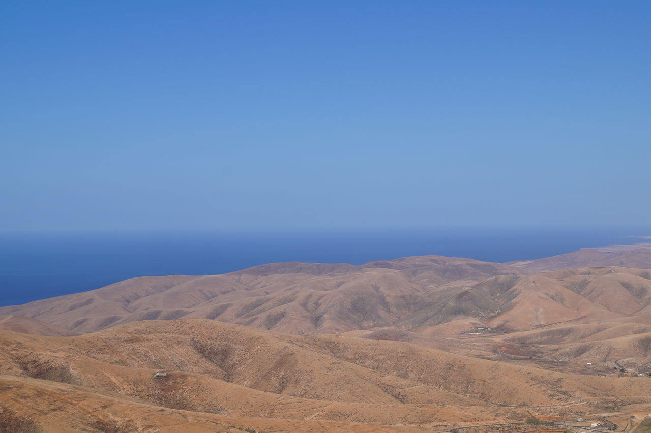 SCENIC VIEW OF DESERT AGAINST BLUE SKY