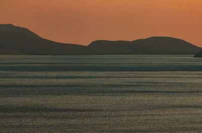 Scenic view of sea against clear sky during sunset
