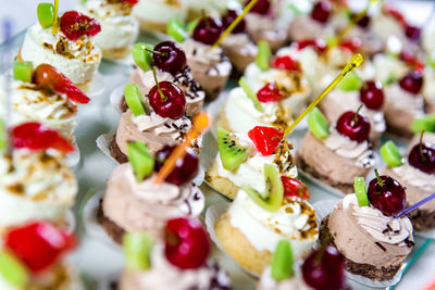 Close-up of small decorated cakes on table