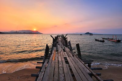 Sunset over the wooden jetty