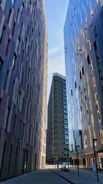 Low angle view of modern buildings against sky