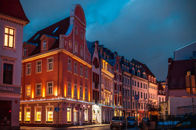 Low angle view of buildings in city at night