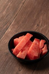 High angle view of strawberries in bowl on table