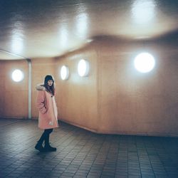 Full length of woman standing at night