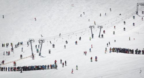 People skiing on snowcapped mountain