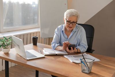 Female doctor working at office