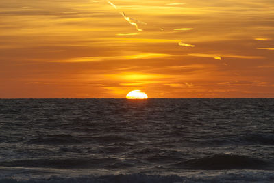 Scenic view of sea at sunset