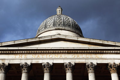 Low angle view of national gallery against cloudy sky