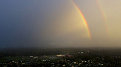 Rainbow over city