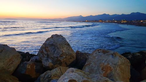 Scenic view of sea against sky during sunset