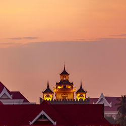 Church of building against sky during sunset