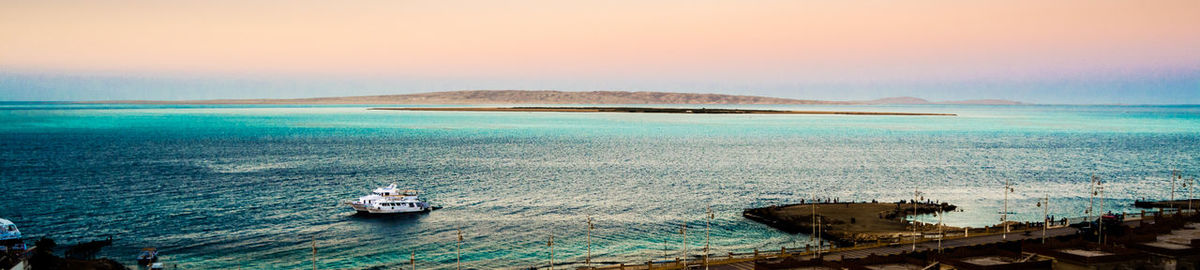 Boats in sea against sky