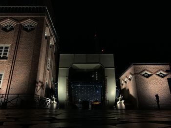 Illuminated buildings in city at night