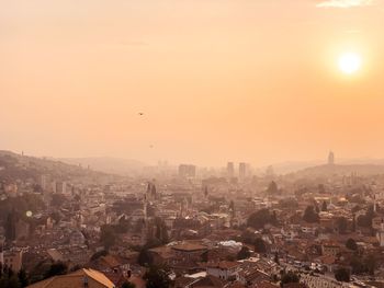 High angle view of city at sunset