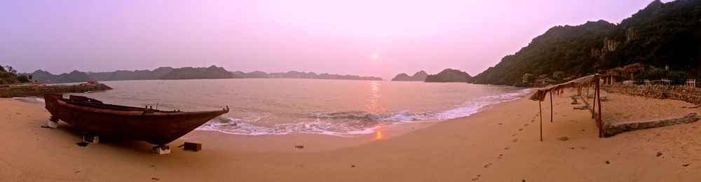 Panoramic view of beach against sky during sunset