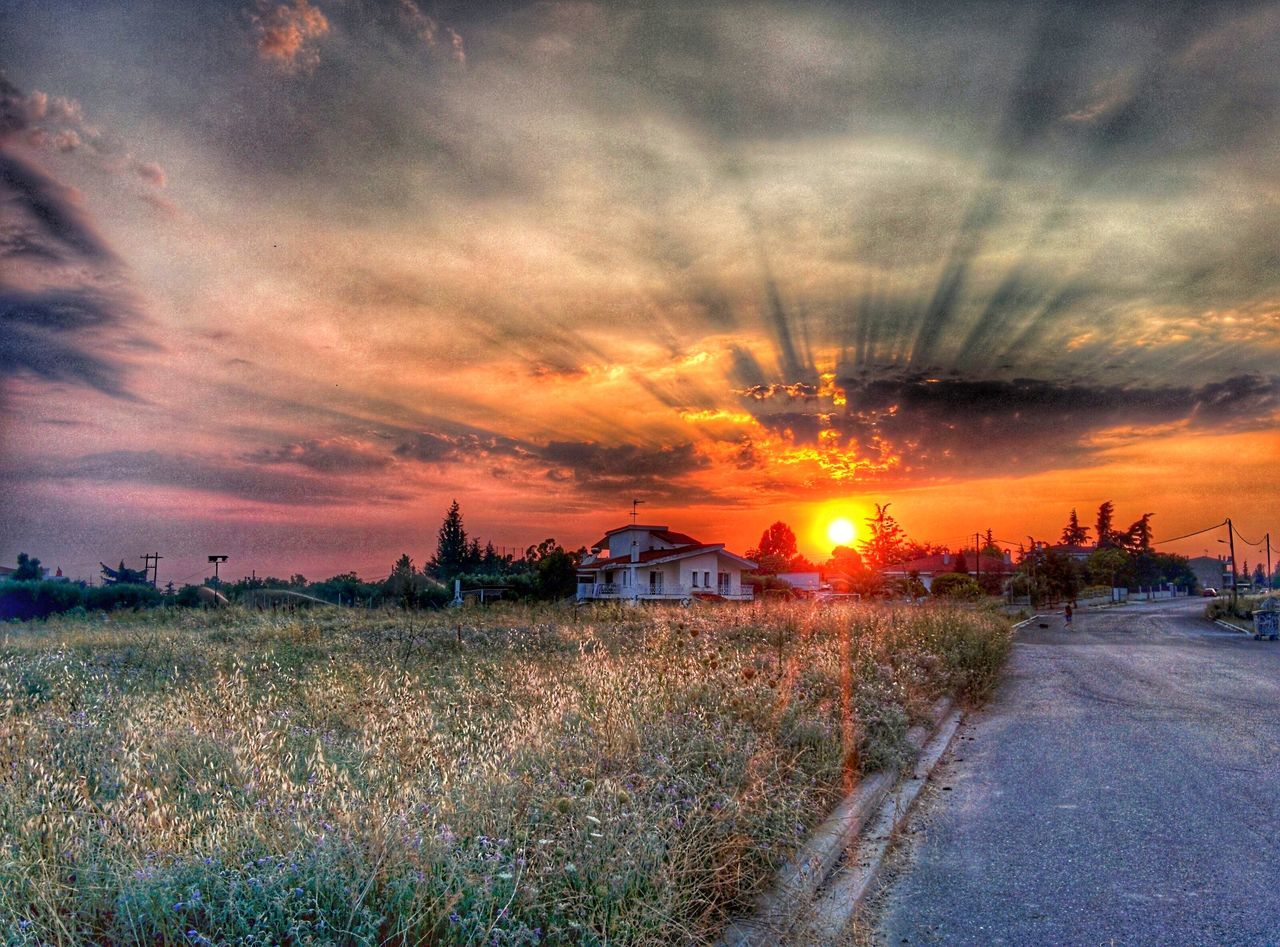 SCENIC VIEW OF FIELD AGAINST DRAMATIC SKY