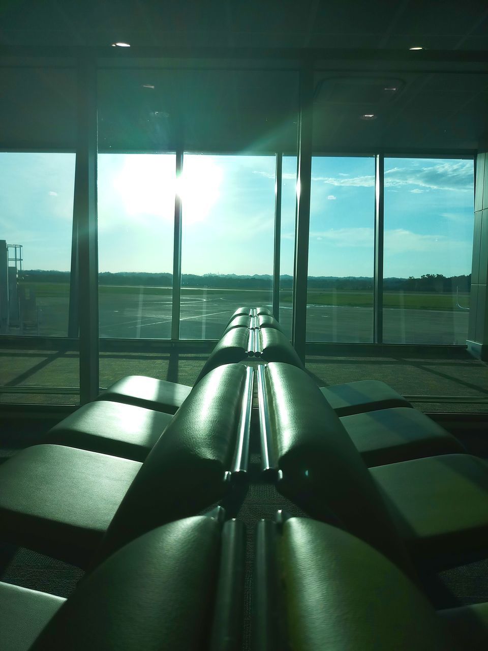 VIEW OF AIRPORT THROUGH WINDOW