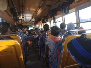 Rear view of people in bus