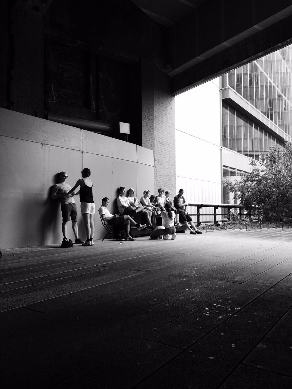 GROUP OF PEOPLE STANDING ON WALL