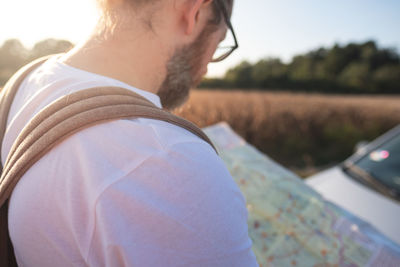 Man reading map outdoors