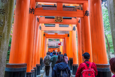 Rear view of people in temple building