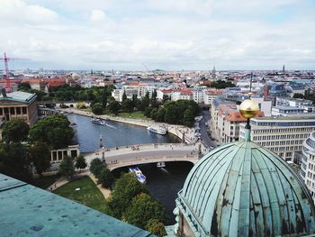 High angle view of city against cloudy sky