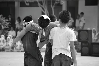 Rear view of girl looking at camera