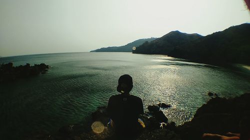 Silhouette of tourists on beach