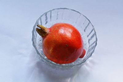 Close-up of strawberry with ice cream on table