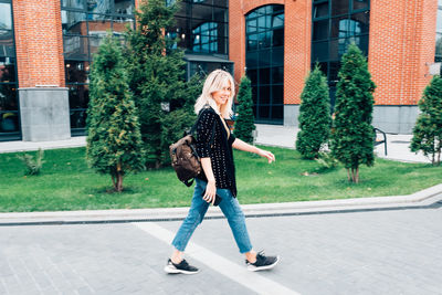 Full length of woman standing in city