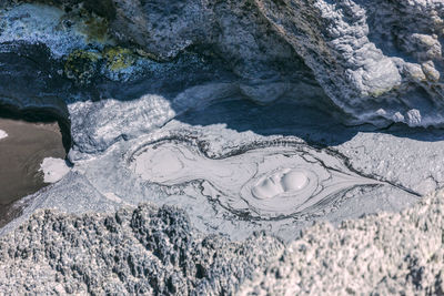 High angle view of frozen sea shore