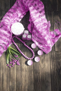 High angle view of pink flowers on wooden table