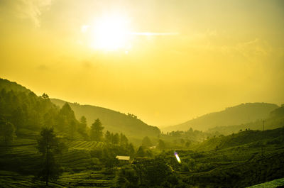 Scenic view of landscape against sky during sunset