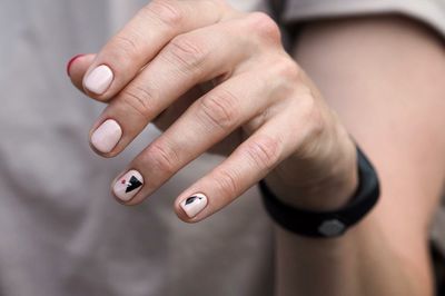Midsection of woman with nail art