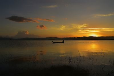 Scenic view of lake against sky during sunset