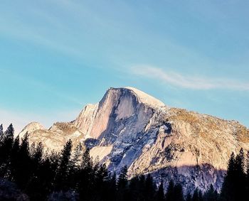 Low angle view of mountain range against sky