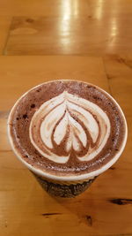 High angle view of cappuccino on table