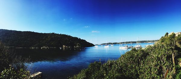 Scenic view of lake against blue sky