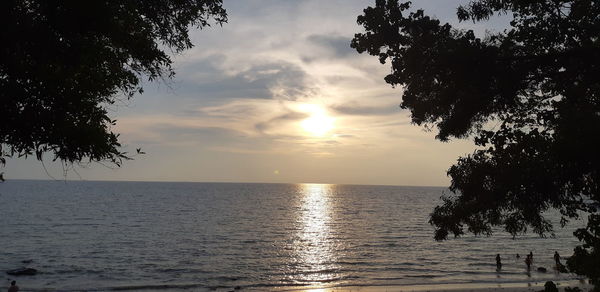 Scenic view of sea against sky at sunset